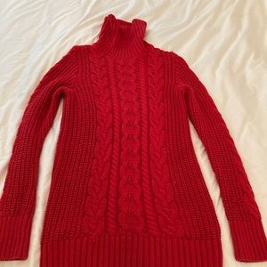 Cable knit turtle neck sweater.